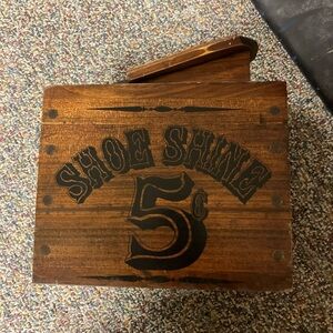 Vintage retro shoe shine box kit with footrest and items inside brush polish